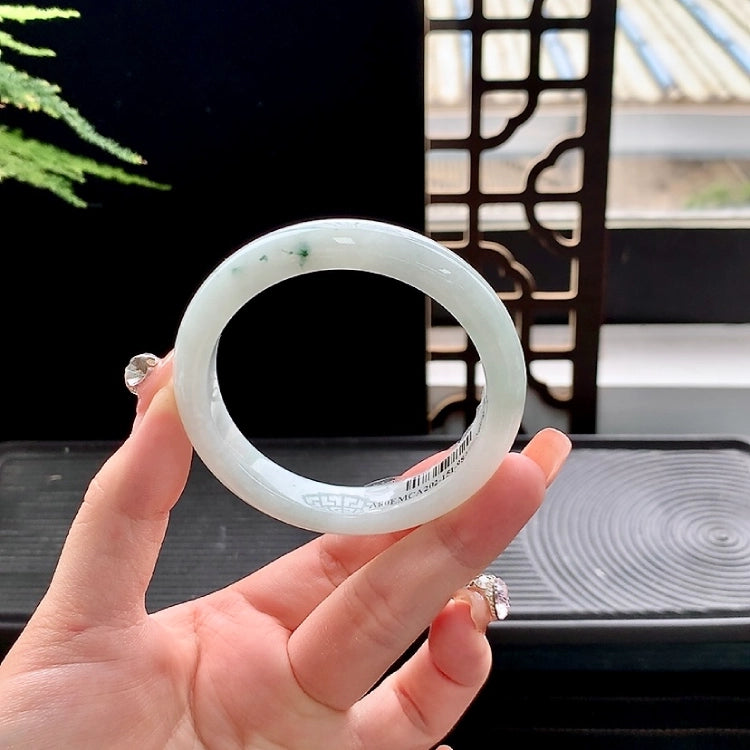 Jadeite bangle with floating color patterns